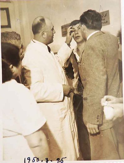 1950 Mar 25 Dr Y. Markarian and Dr Pierr checking a patients eye
