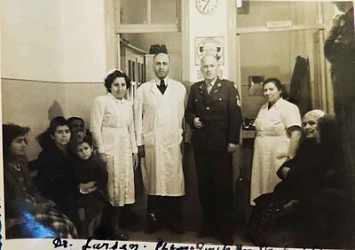 1950 Mar 28 Intl. Red cross repr Dr Larsen visiting the AGBU Dispensary with Dr Y. Markarian, nurses and some patients