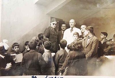 1950 Mar 28 Intl. Red Cross repr. Dr Larsen visiting an Armenian school with the AGBU Dispensary Dr Y. Markarian, nurses and Trustee members
