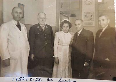 1950 Mar 28 Intl. Red cross representatve Dr Larsen, in the AGBU Dispensary with Dr Y. Markarian, nurse and Trustee members