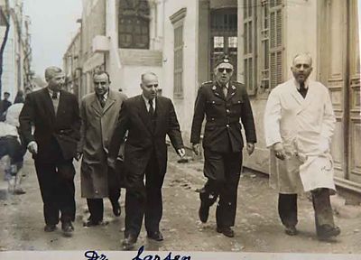 1950 Mar 28 Intl. Red cross repr Dr Larsen visiting the AGBU Dispensary neighborhood with Dr Y. Markarian and Trustees