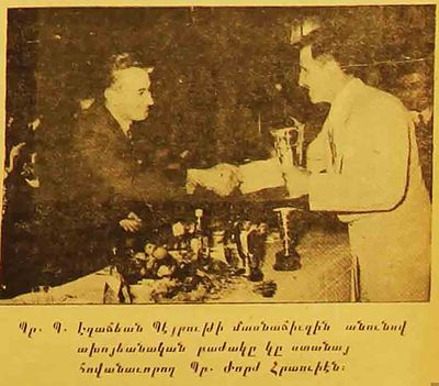 1954 Sep 11-12 Mi George Hraoui handlig the Champ Traup to B. EzadjianAYA Sport Gathering in Zah